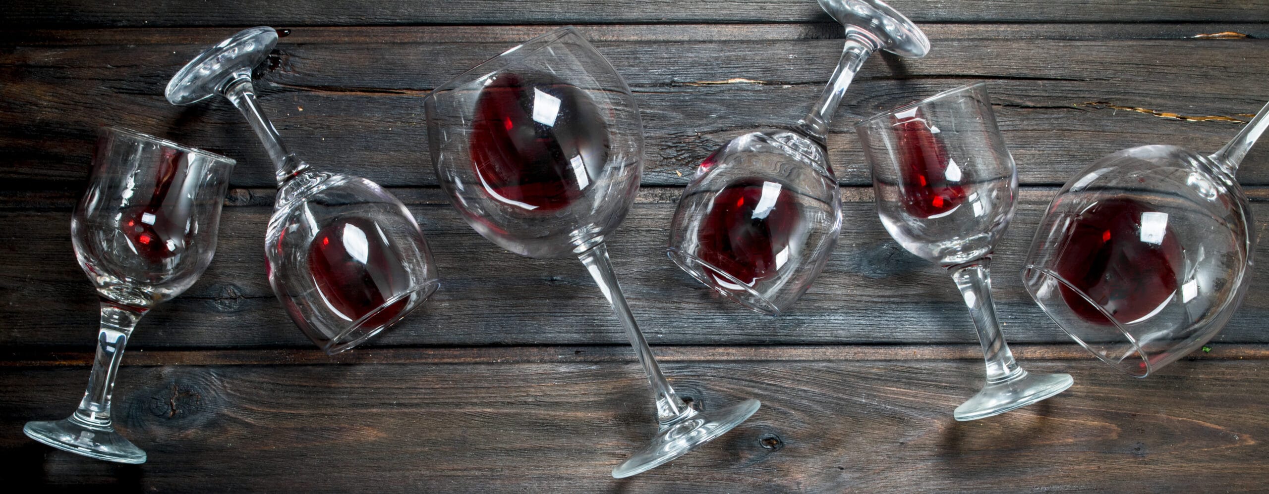 Wine Background. Glasses Of Red Wine. On A Wooden Background.