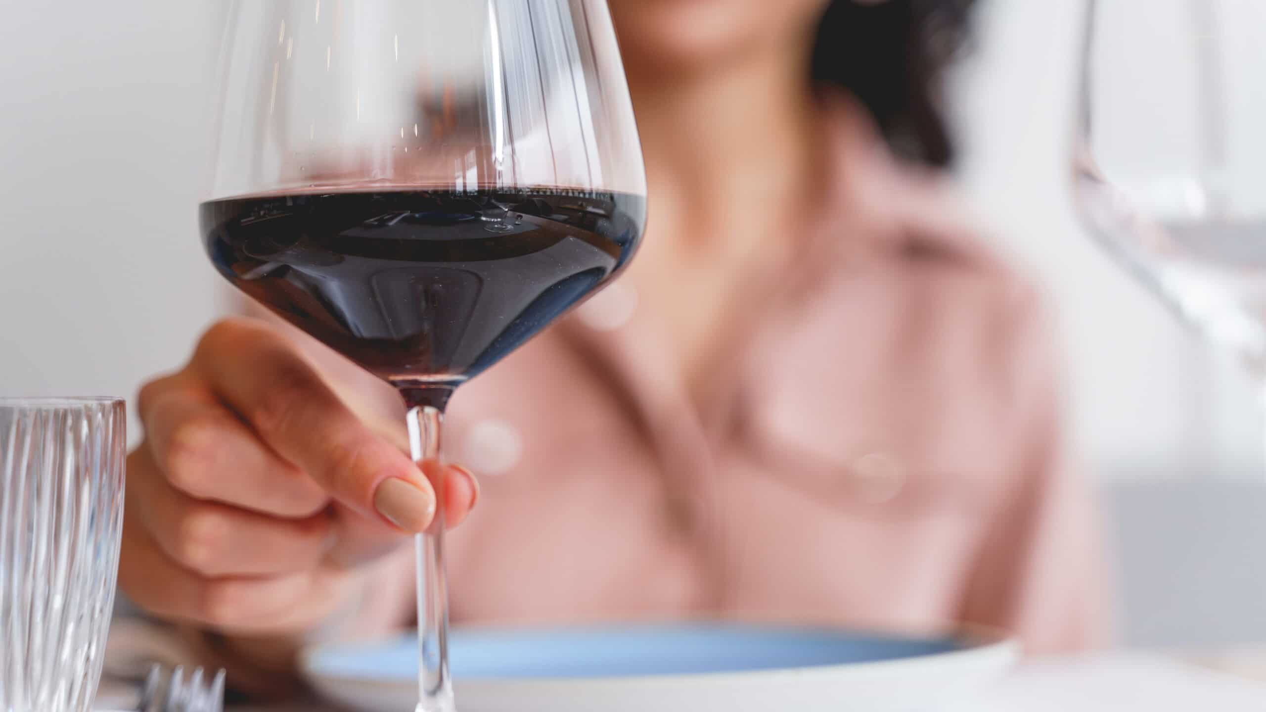 woman tasting wine