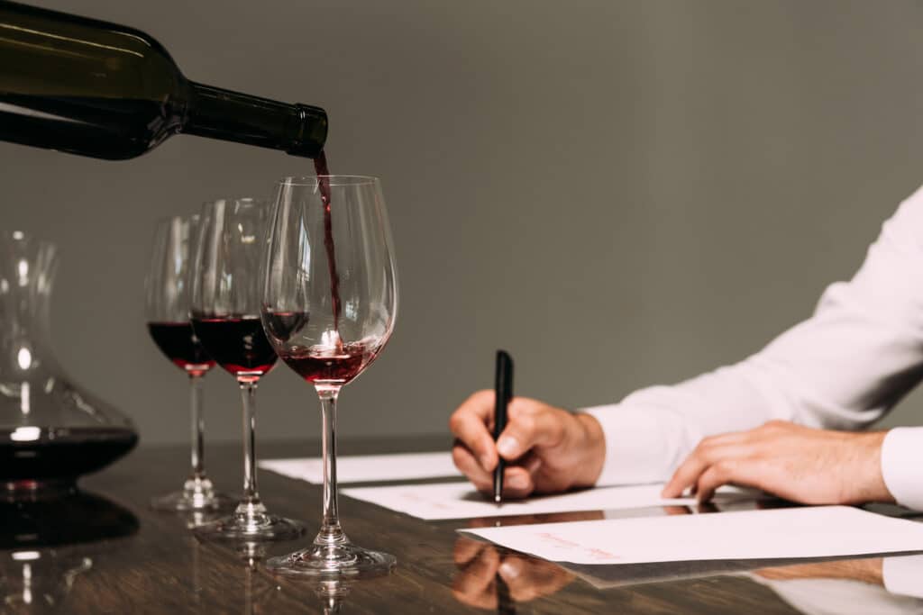 Partial View Of Sommelier Writing At Table With Wi 2021 08 31 03 42 19 Utc