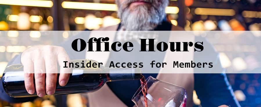 Bartender pouring wine for exclusive member event.