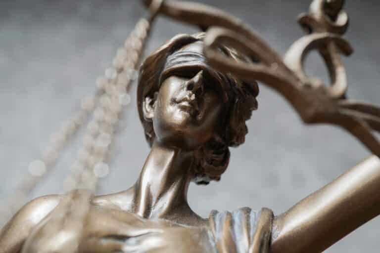 Close-up of blindfolded Lady Justice statue