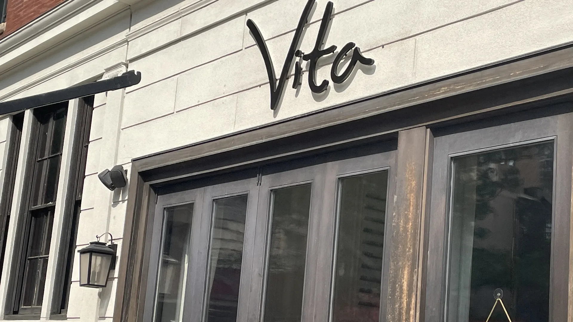 Vito restaurant storefront with double glass doors