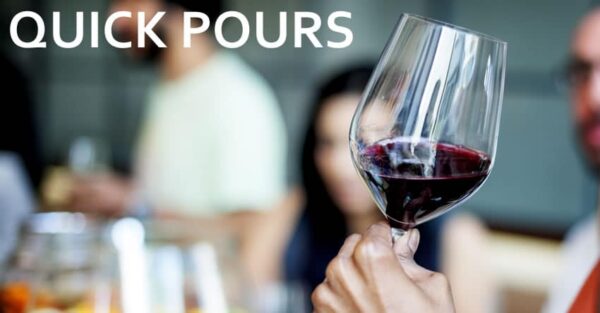 Hand holding red wine glass, 'Quick Pours' text.