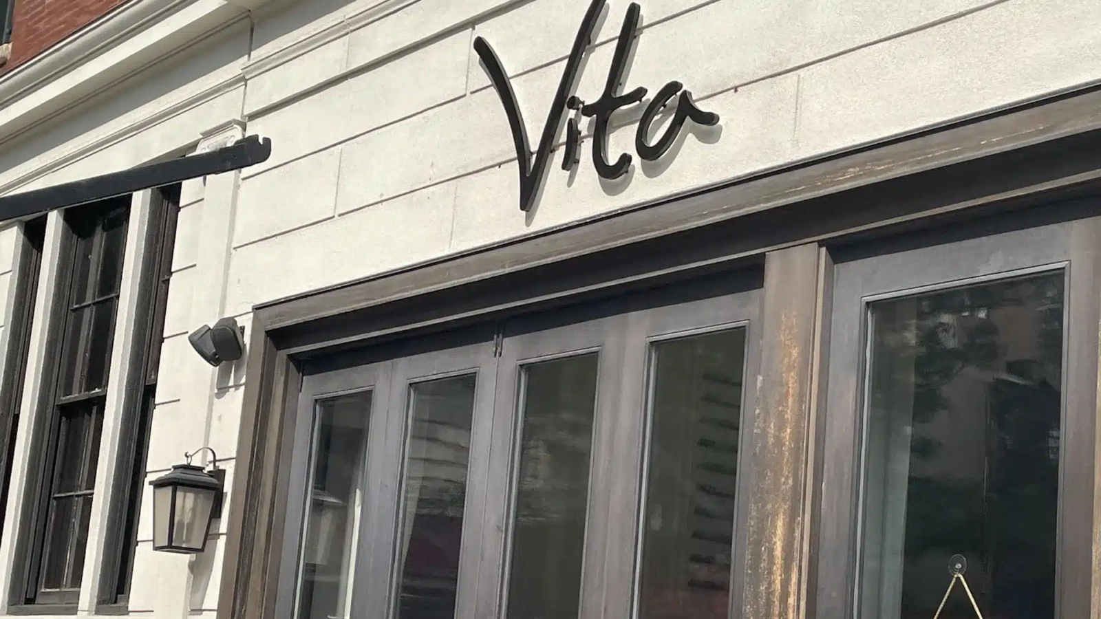 Vito restaurant storefront with double glass doors